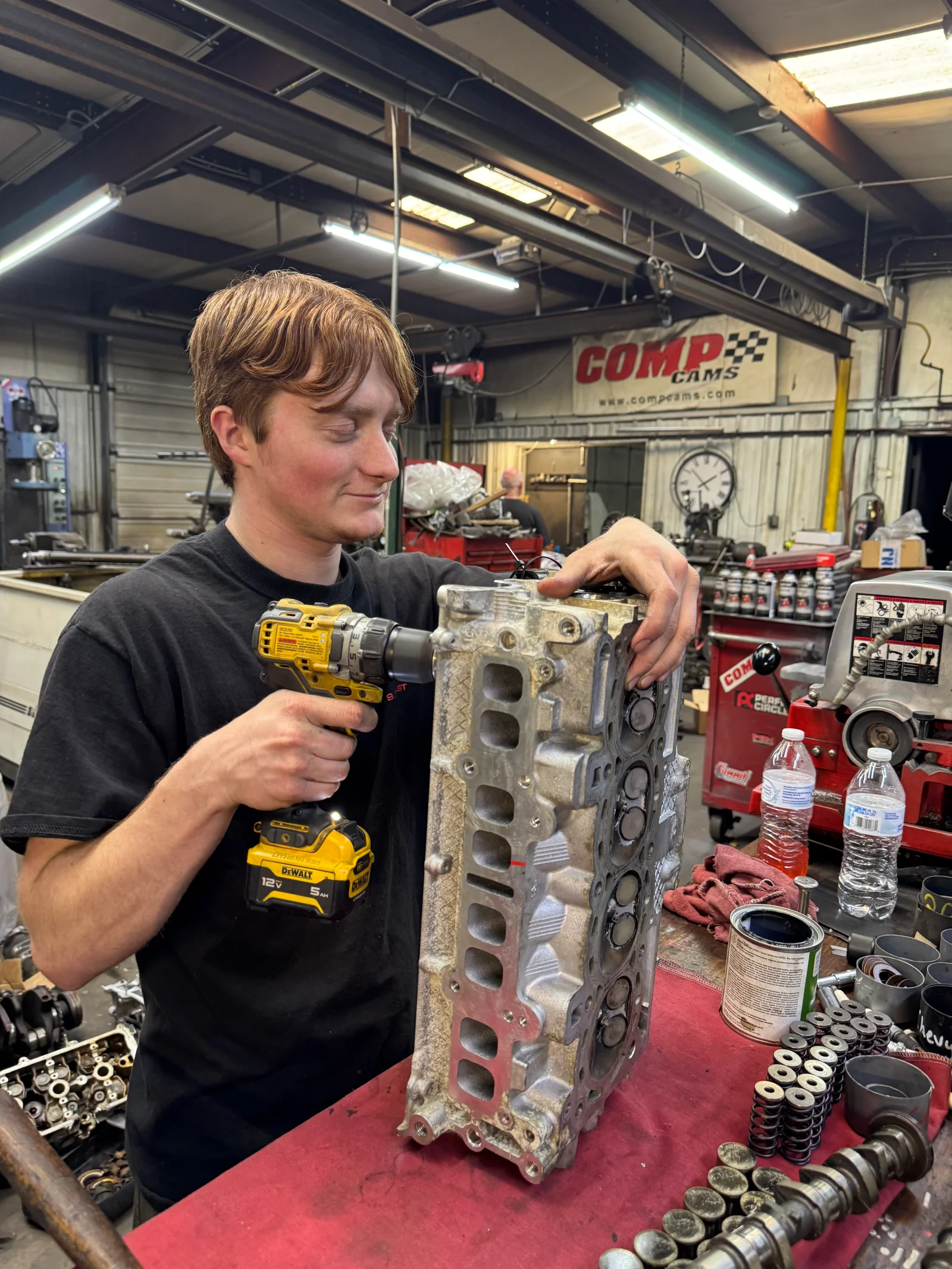 Jared performing cylinder head disassembly work at G&S Machine Shop