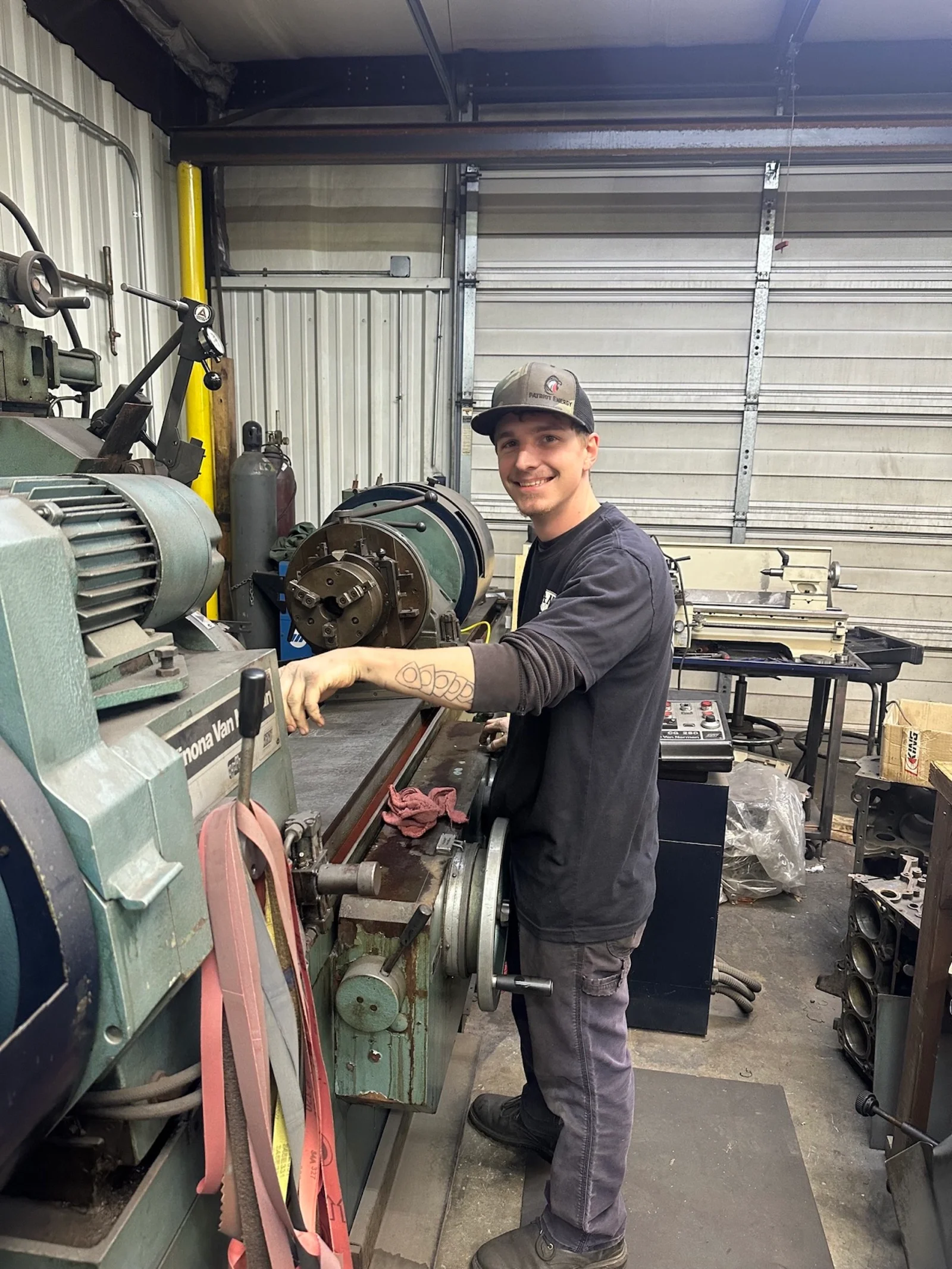 Seth setting up the crankshaft grinder at G&S Machine Shop
