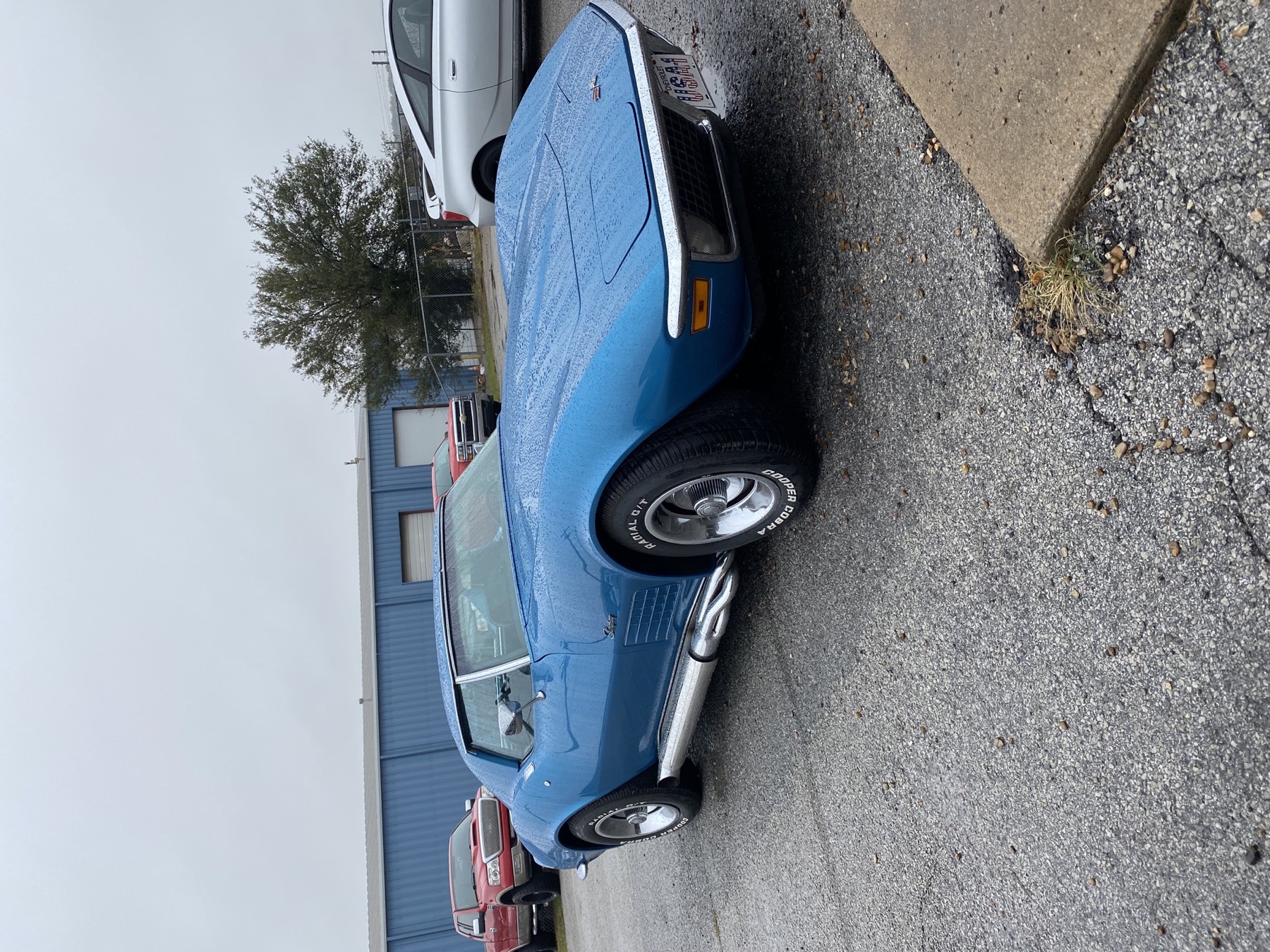 Chevrolet Corvette C3 classic sports car in shop for automotive service and engine work