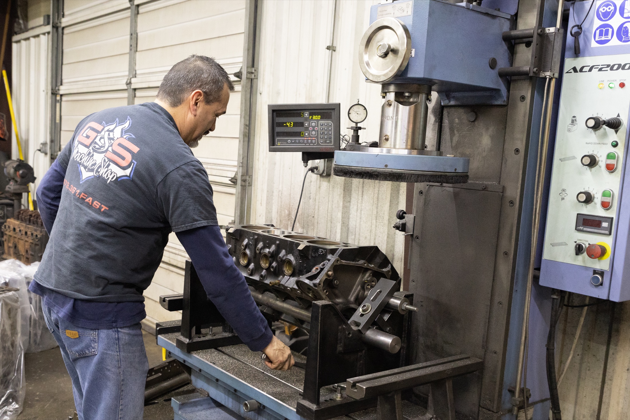 Machinist setting up Chevy big block for cylinder boring and decking