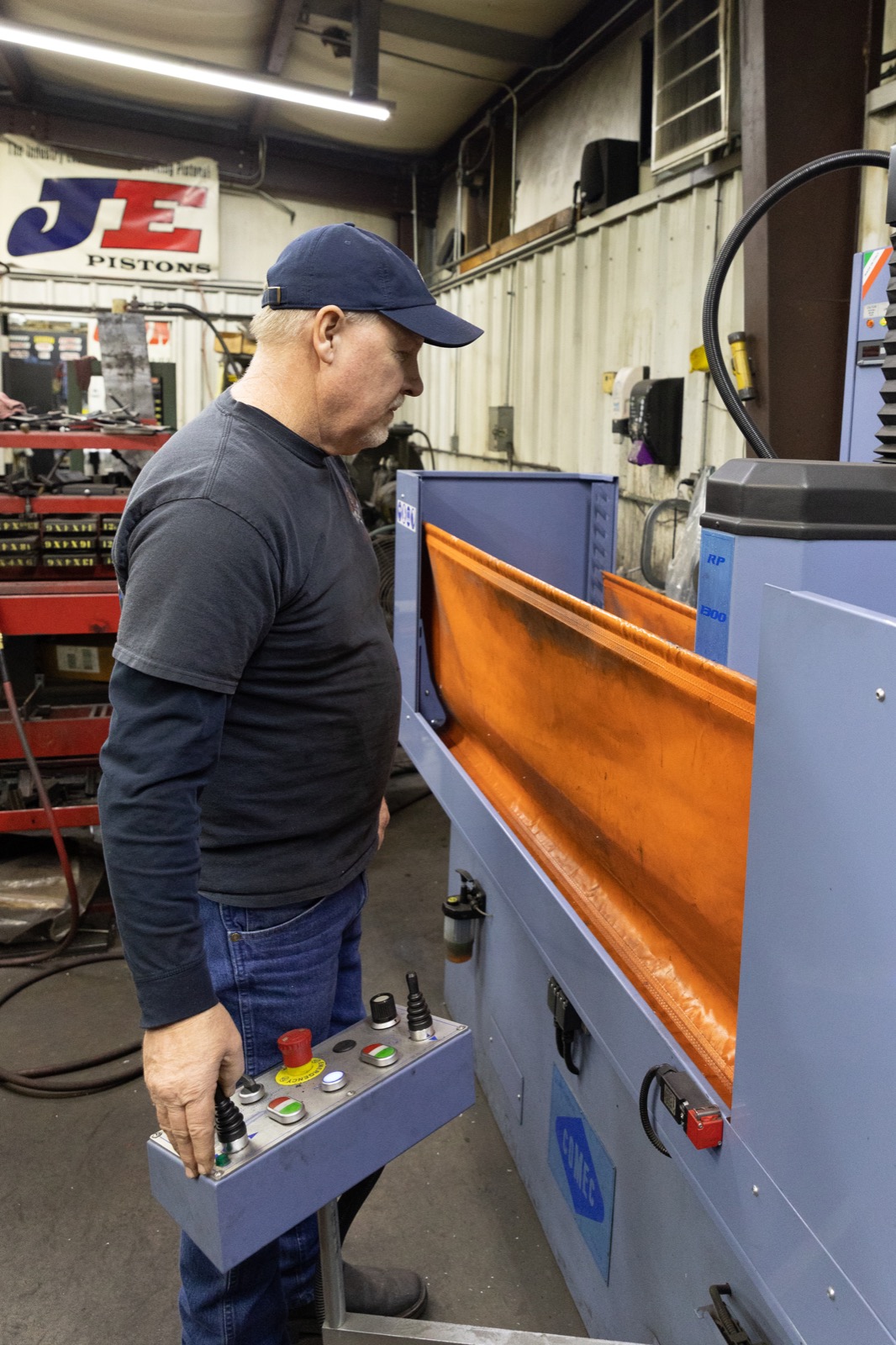 Stevie resurfacing cylinder head using precision machining equipment for engine rebuild work